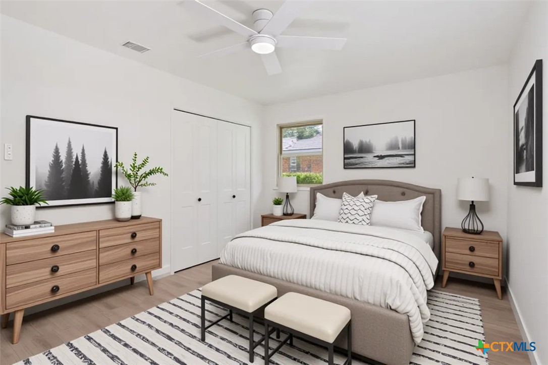 4412 Briar Cliff Road Temple, TX 76502 - Photo 22 of 35 a bedroom with a bed and a painting on the wall