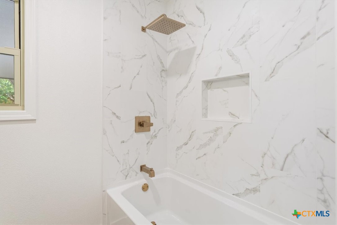 4412 Briar Cliff Road Temple, TX 76502 - Photo 31 of 35 a bathroom with a bathtub