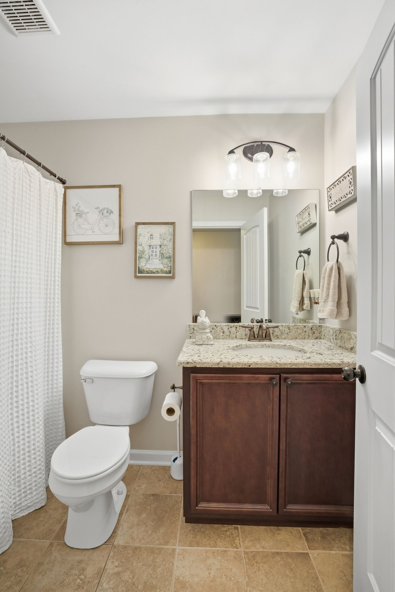 211 Fox Den Way Murfreesboro, TN 37130 - Photo 30 of 64 a bathroom with a granite countertop toilet sink and mirror