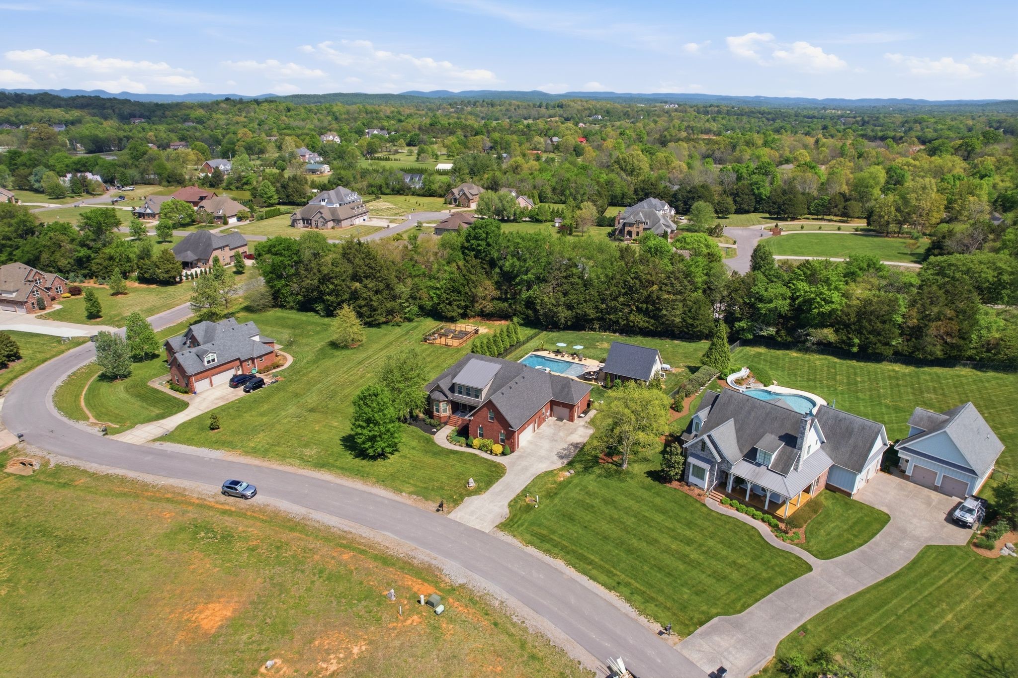 211 Fox Den Way Murfreesboro, TN 37130 - Photo 59 of 64 an aerial view of a house with a garden and lake view