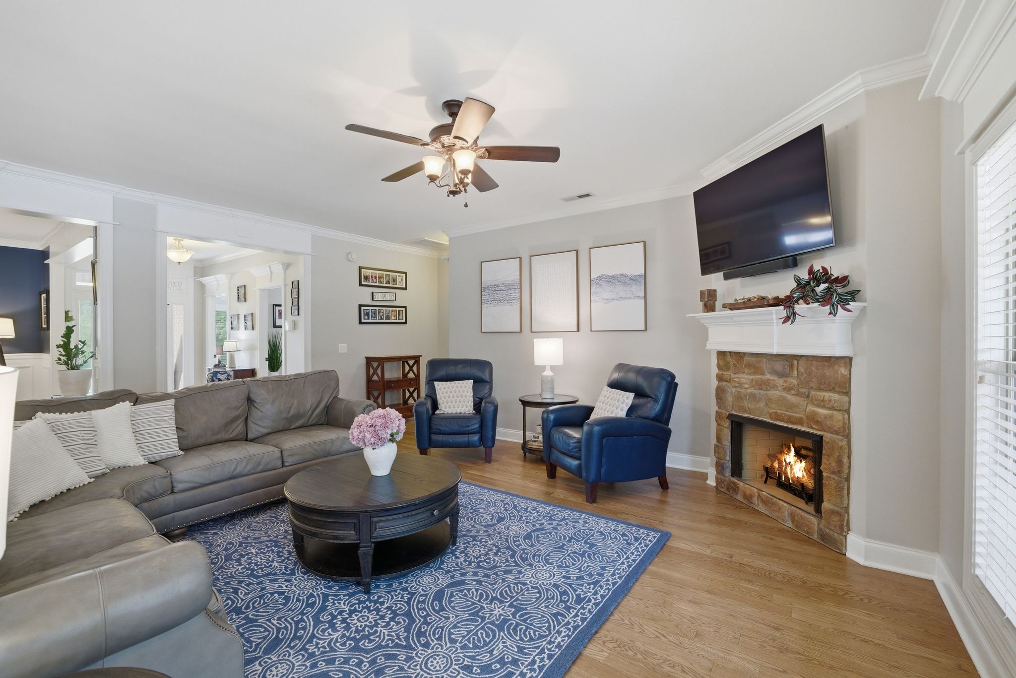 211 Fox Den Way Murfreesboro, TN 37130 - Photo 7 of 64 a living room with furniture a flat screen tv and a fireplace