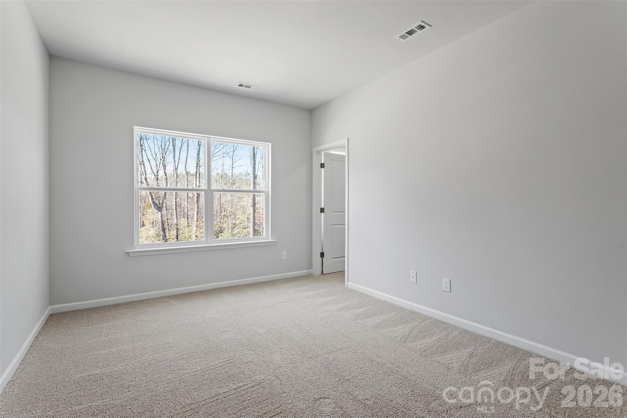 5835 Tuckaseegee Road, Unit 9 Charlotte, NC 28208 - Photo 17 of 29 an empty room with windows