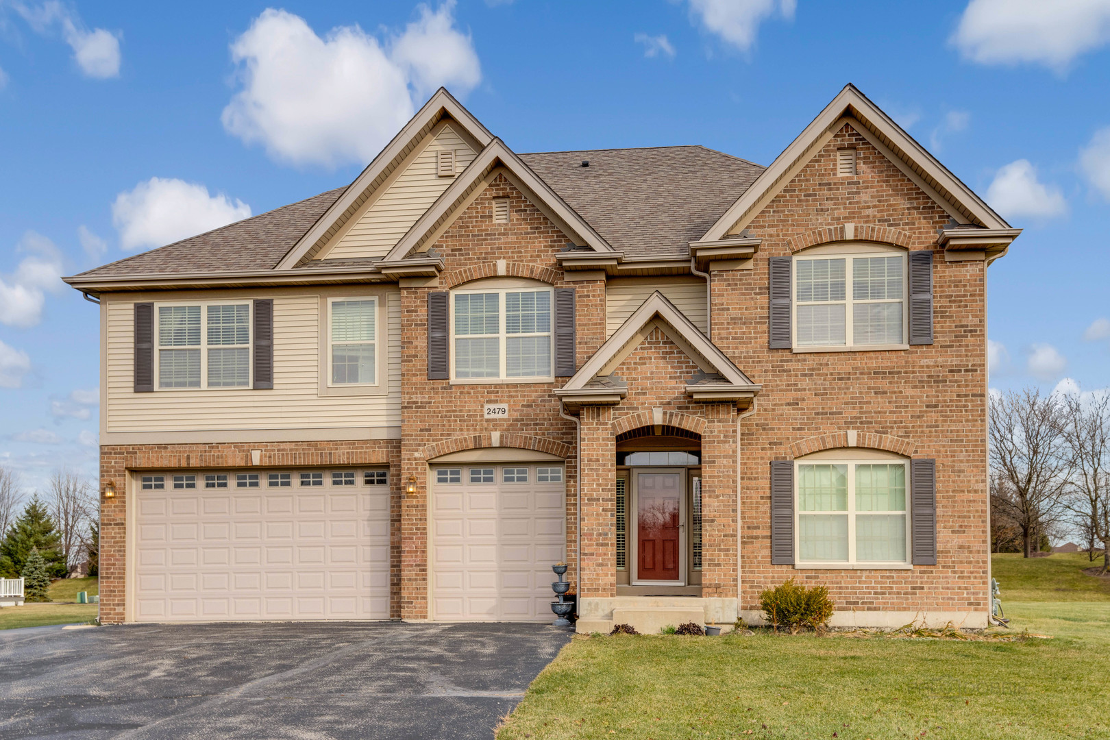 2479 Downing Court Gurnee, IL 60031 - Photo 1 of 21 a front view of a house with a yard