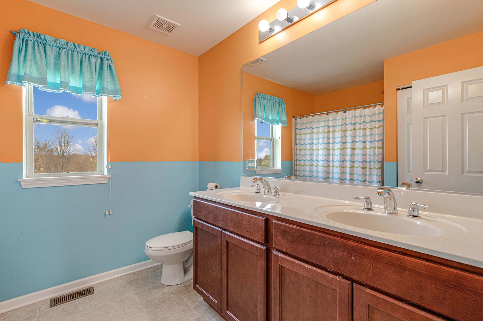 2479 Downing Court Gurnee, IL 60031 - Photo 19 of 21 a bathroom with a sink a toilet and mirror