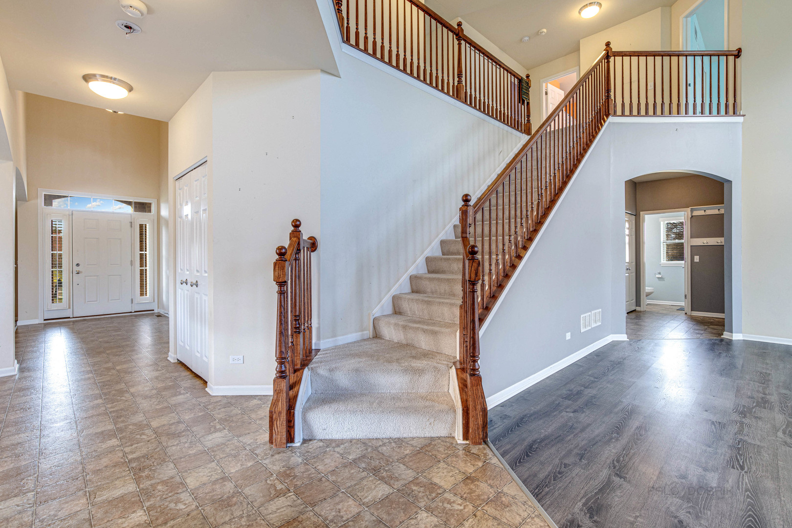 2479 Downing Court Gurnee, IL 60031 - Photo 5 of 21 a view of entryway and hall with wooden floor