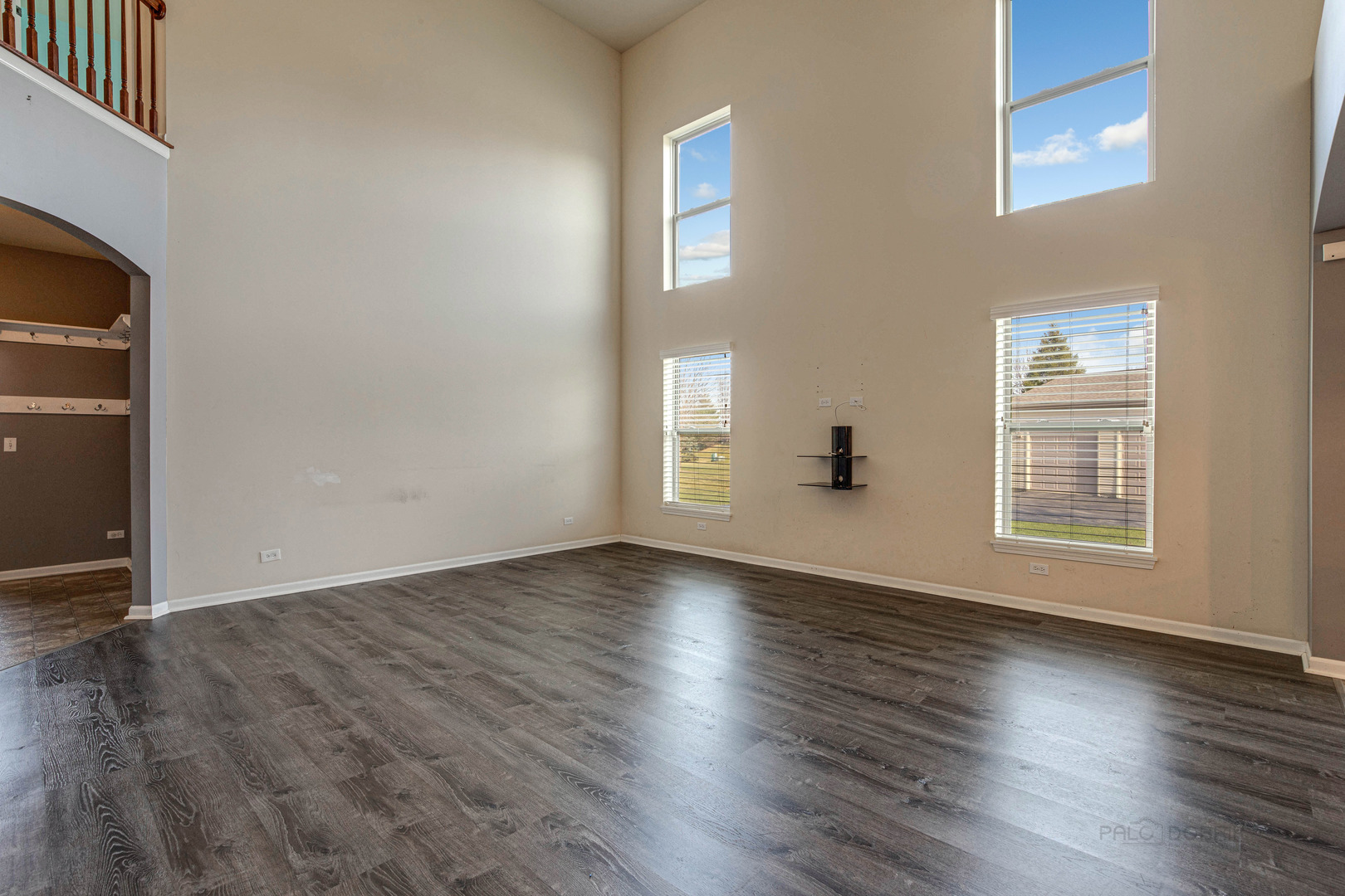 2479 Downing Court Gurnee, IL 60031 - Photo 6 of 21 an empty room with wooden floor and windows