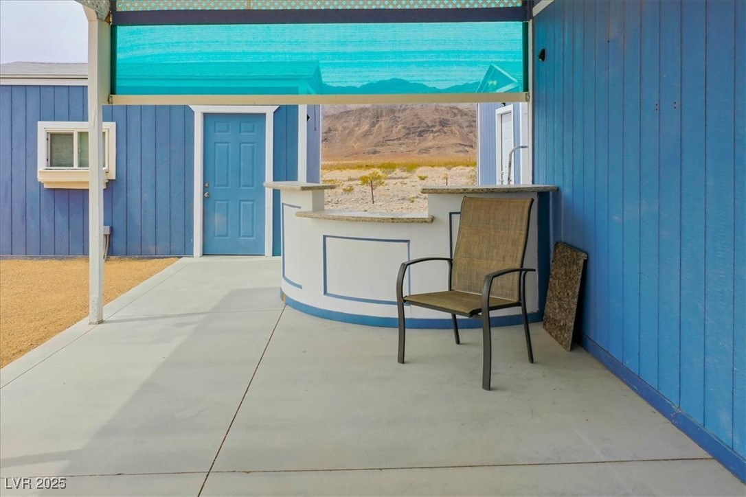 520 Burt Street Pahrump, NV 89060 - Photo 20 of 99 View of patio / terrace featuring a mountain view
