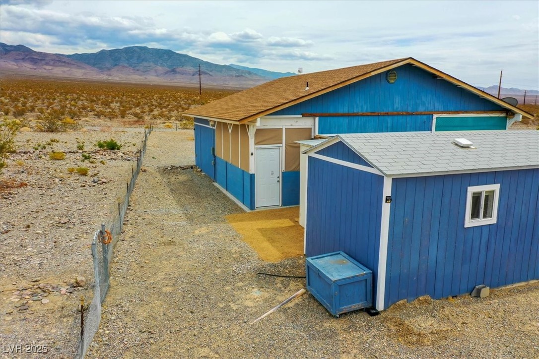 520 Burt Street Pahrump, NV 89060 - Photo 25 of 99 View of outdoor structure featuring a mountain view