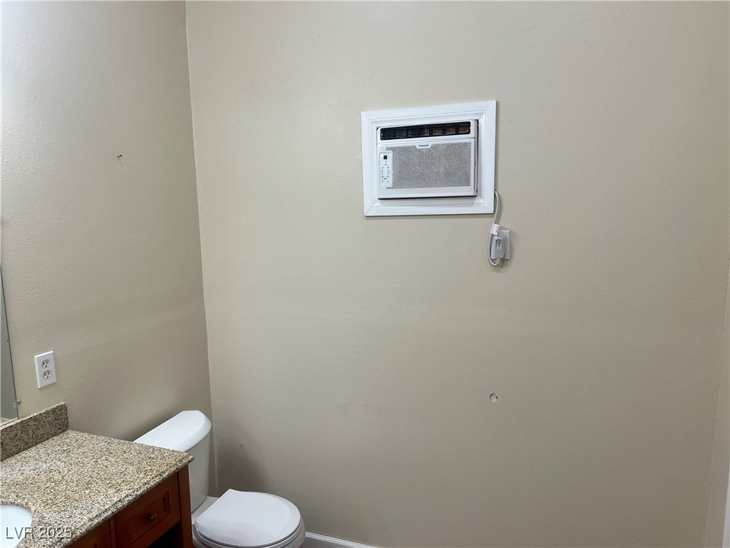 520 Burt Street Pahrump, NV 89060 - Photo 45 of 99 Bathroom with vanity and an AC wall unit