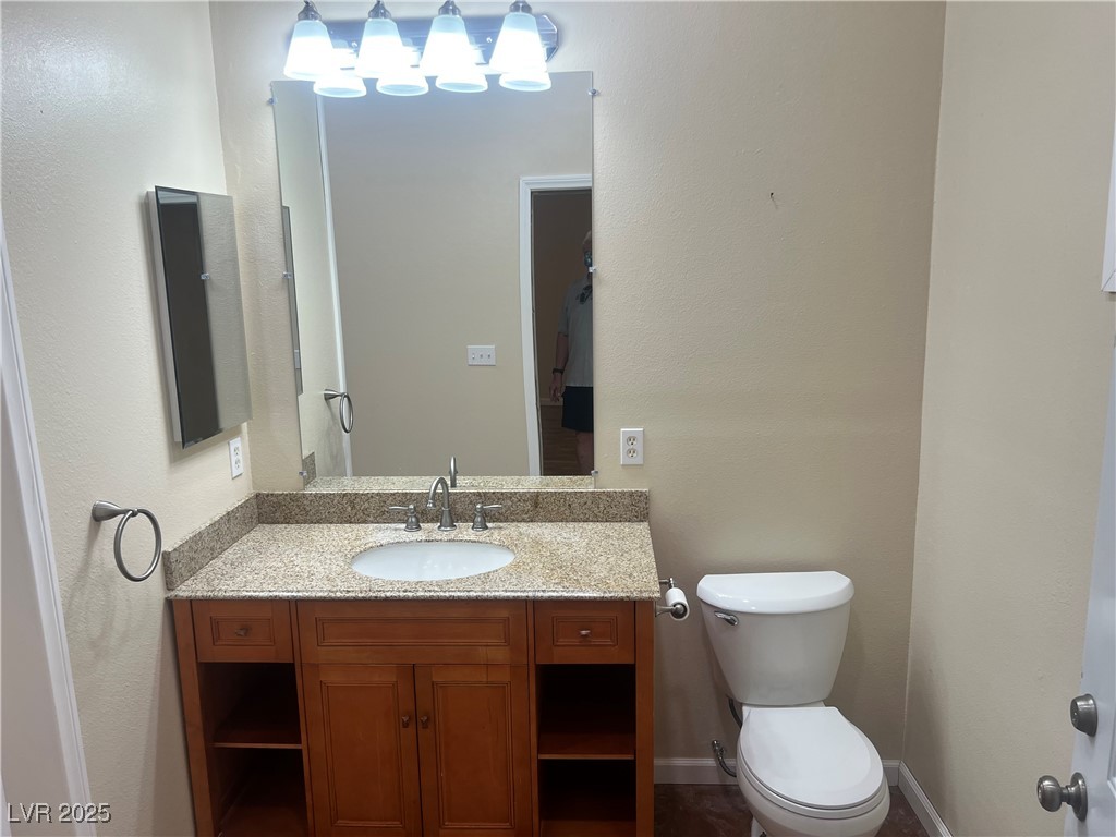 520 Burt Street Pahrump, NV 89060 - Photo 47 of 99 Half bath featuring vanity and a textured wall