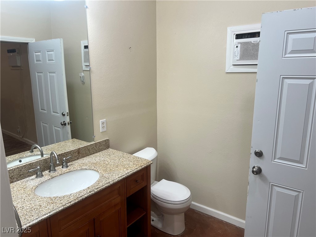 520 Burt Street Pahrump, NV 89060 - Photo 50 of 99 Bathroom featuring vanity and a wall mounted AC