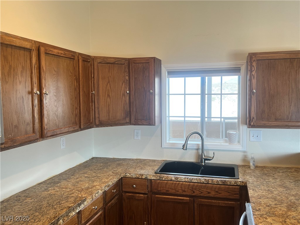 520 Burt Street Pahrump, NV 89060 - Photo 64 of 99 Kitchen with a sink and brown cabinets