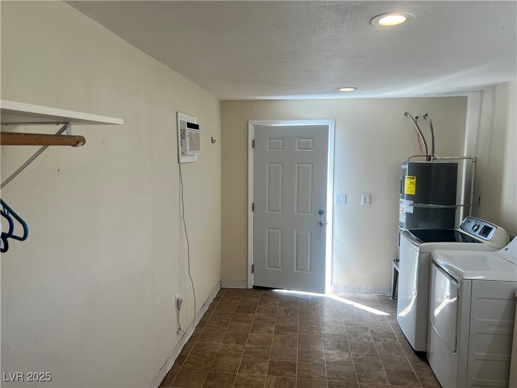 520 Burt Street Pahrump, NV 89060 - Photo 74 of 99 Laundry area featuring washing machine and clothes dryer and secured water heater