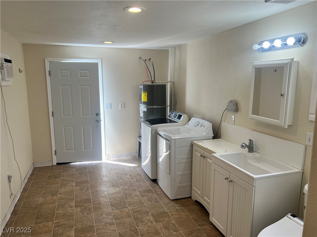 520 Burt Street Pahrump, NV 89060 - Photo 77 of 99 Laundry area featuring washer and clothes dryer, recessed lighting, and cabinet space