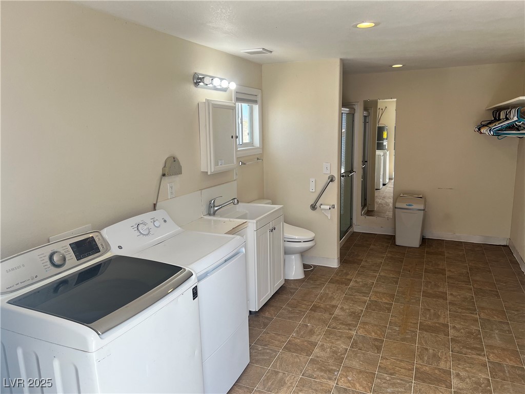 520 Burt Street Pahrump, NV 89060 - Photo 79 of 99 Washroom with washer and clothes dryer and recessed lighting
