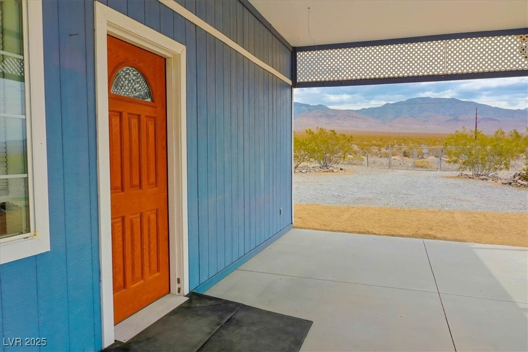 520 Burt Street Pahrump, NV 89060 - Photo 91 of 99 Property entrance featuring a mountain view and a patio