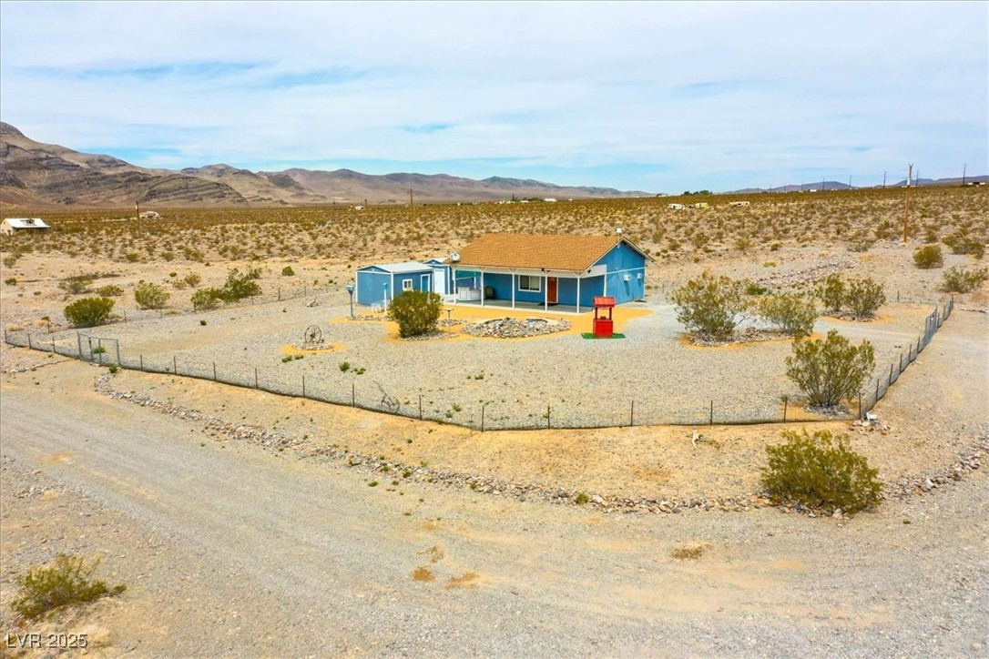 520 Burt Street Pahrump, NV 89060 - Photo 97 of 99 View of jungle gym featuring a mountain view and view of desert landscape