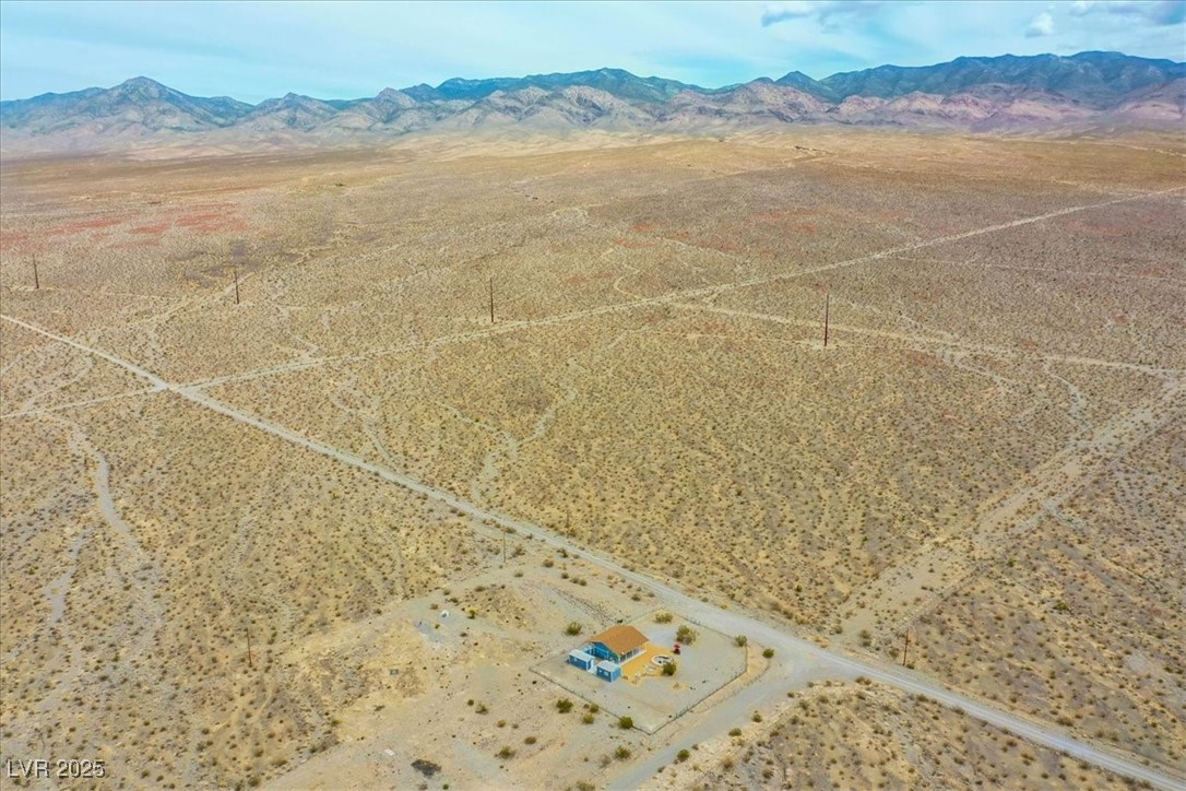 520 Burt Street Pahrump, NV 89060 - Photo 98 of 99 Aerial view of sparsely populated area with mountains