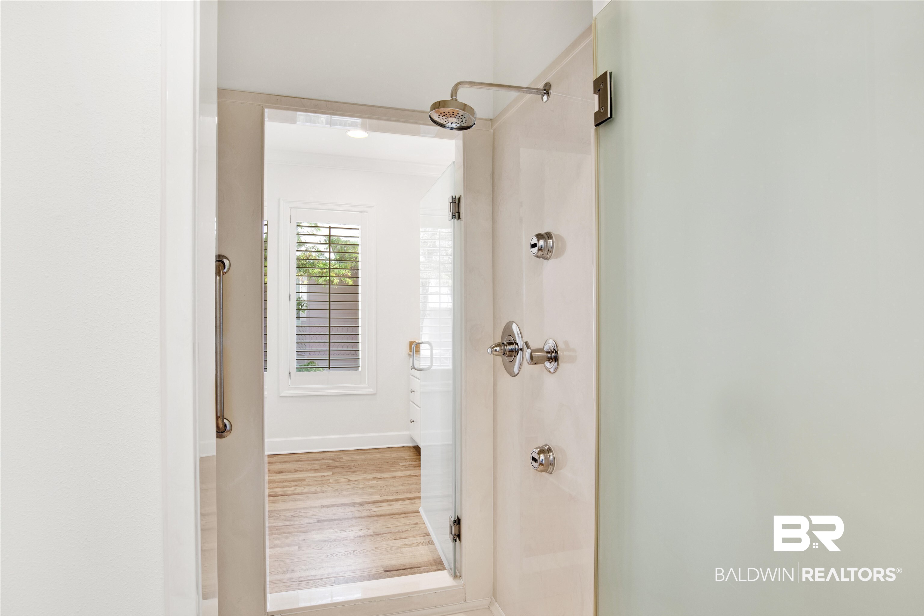 33400 River Road Orange Beach, AL 36561 - Photo 42 of 72 Bathroom featuring wood-type flooring and a shower