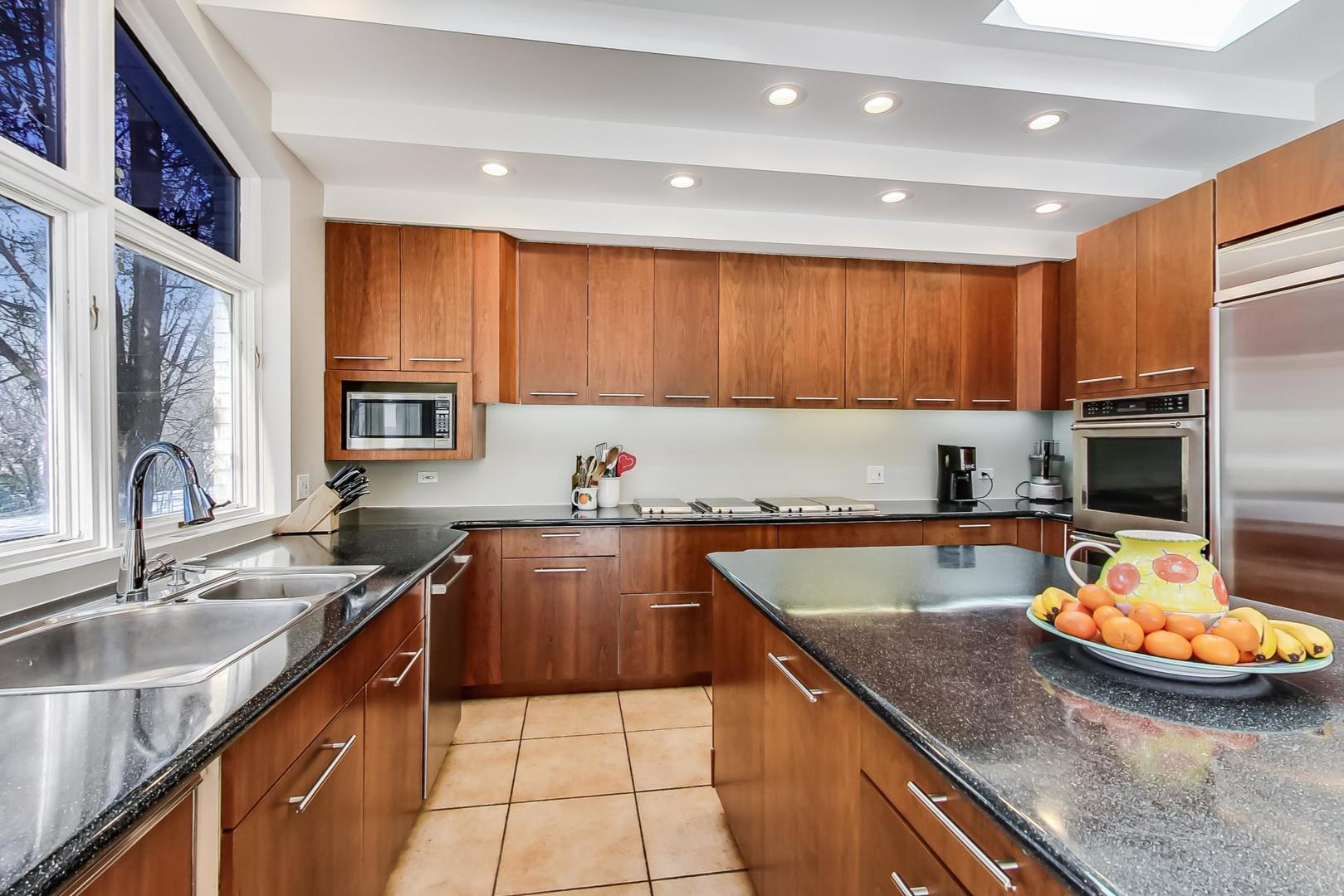 1846 Smith Road Northbrook, IL 60062 - Photo 19 of 58 a kitchen with a sink stove and cabinets