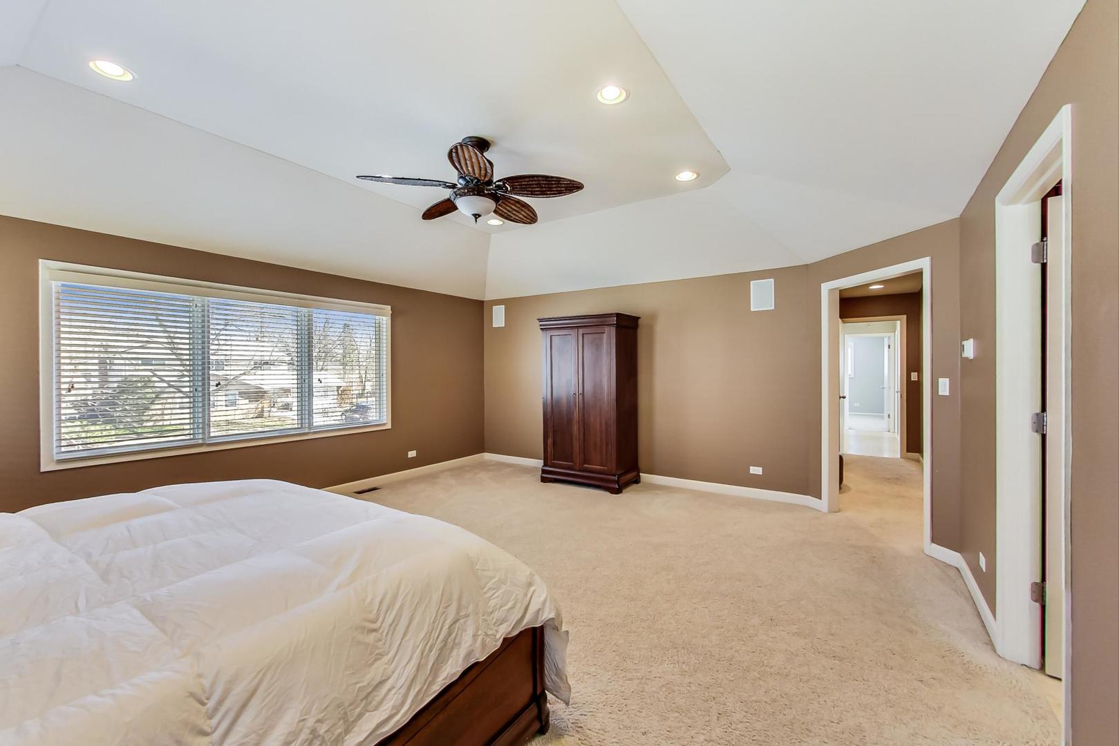 1846 Smith Road Northbrook, IL 60062 - Photo 25 of 58 a spacious bedroom with a large bed and a large window