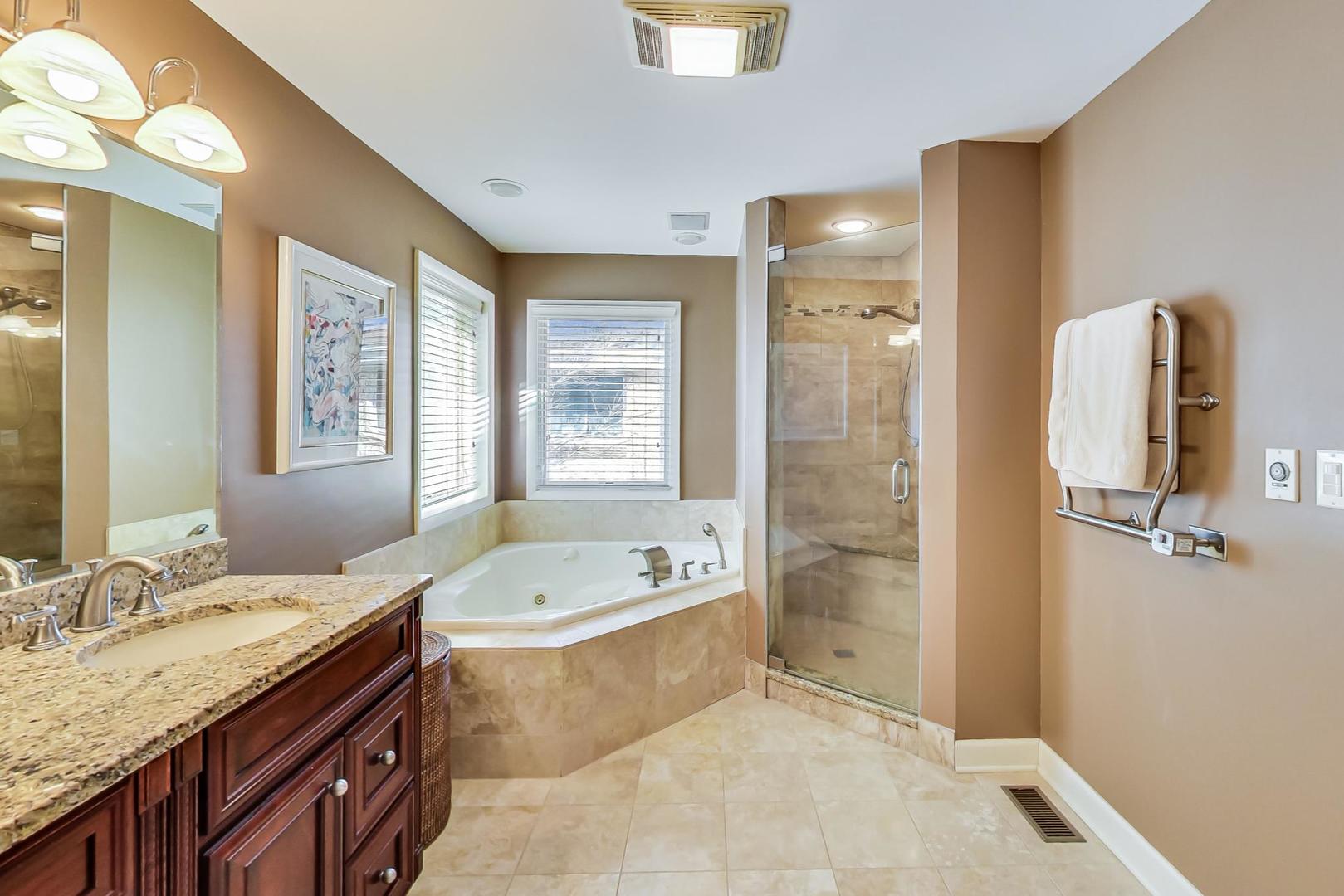 1846 Smith Road Northbrook, IL 60062 - Photo 27 of 58 a bathroom with a granite countertop tub sink and mirror