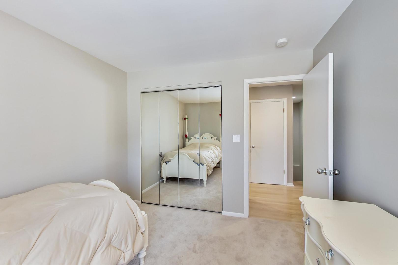 1846 Smith Road Northbrook, IL 60062 - Photo 38 of 58 a bedroom with a bed and a couch