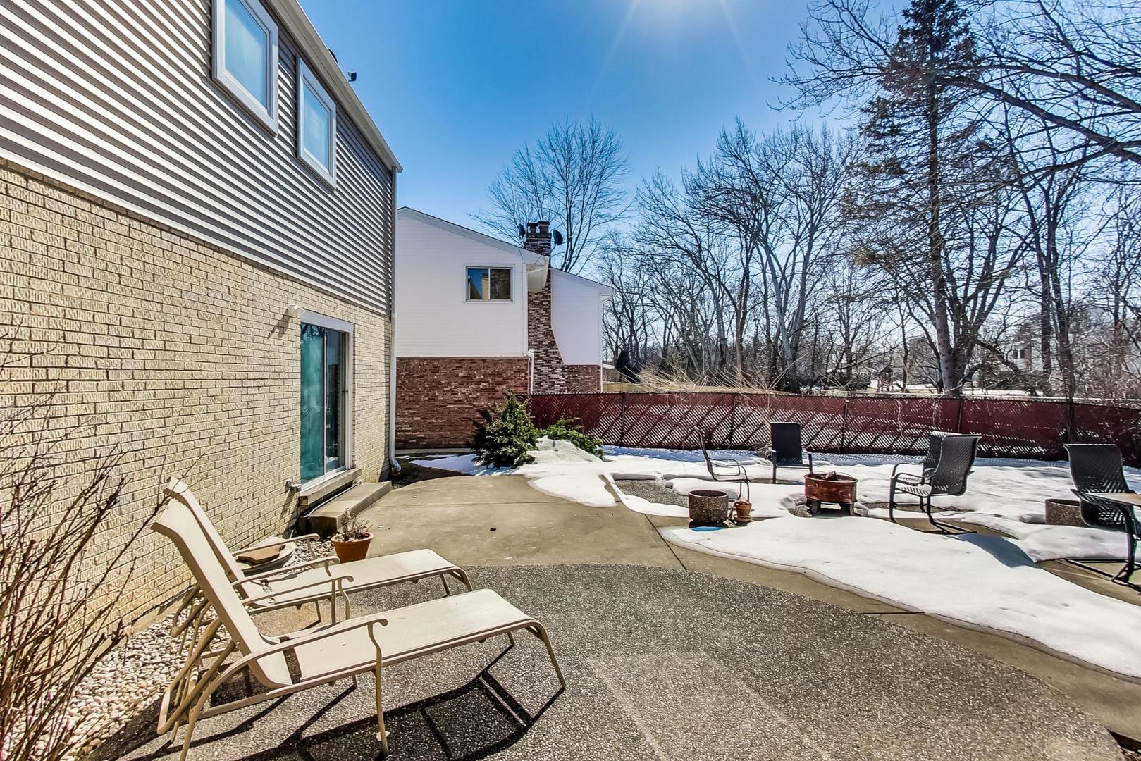 1846 Smith Road Northbrook, IL 60062 - Photo 49 of 58 a view of backyard with furniture and a fire pit