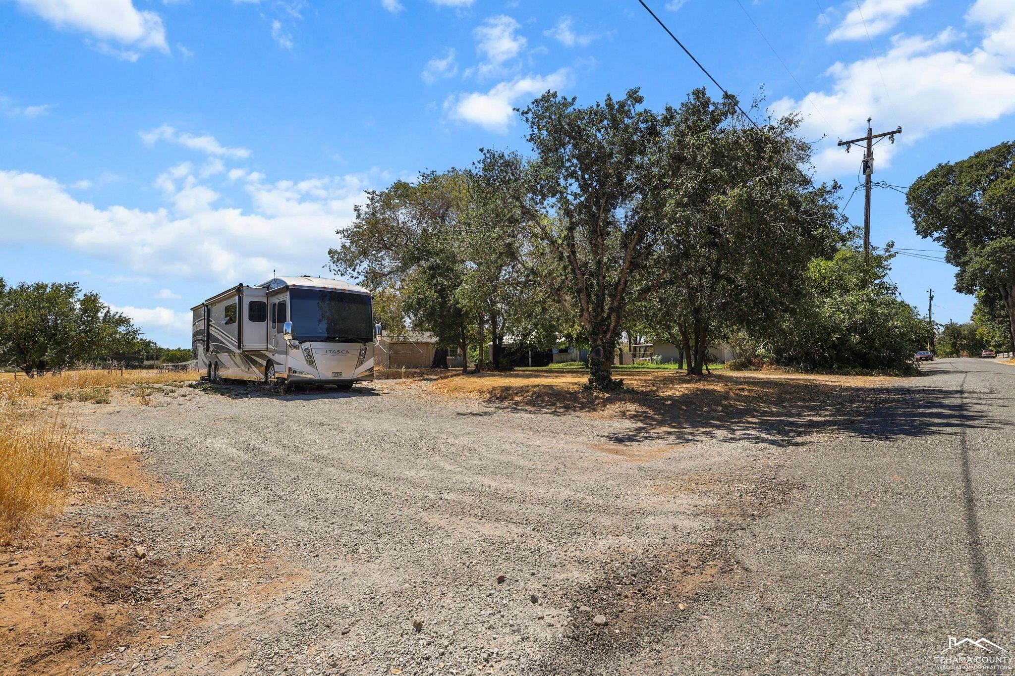 22275 Brent Road Red Bluff, CA 96080 - Photo 44 of 47 a view of a house with truck parked on a road
