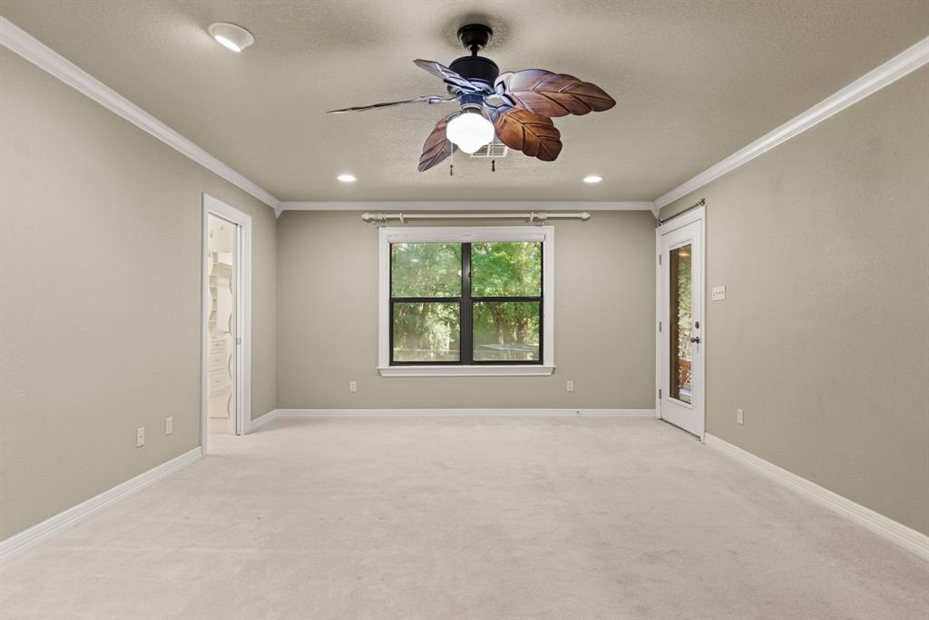 13539 Chapel Road Lorena, TX 76655 - Photo 14 of 37 Carpeted room featuring a ceiling fan with leaf-shaped blades, recessed lighting, and crown molding