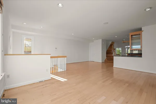a kitchen with granite countertop a table and chairs in it