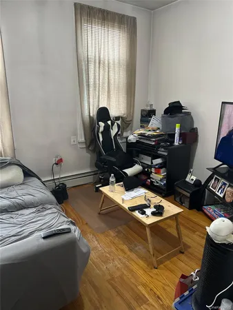 a bedroom with furniture and a window