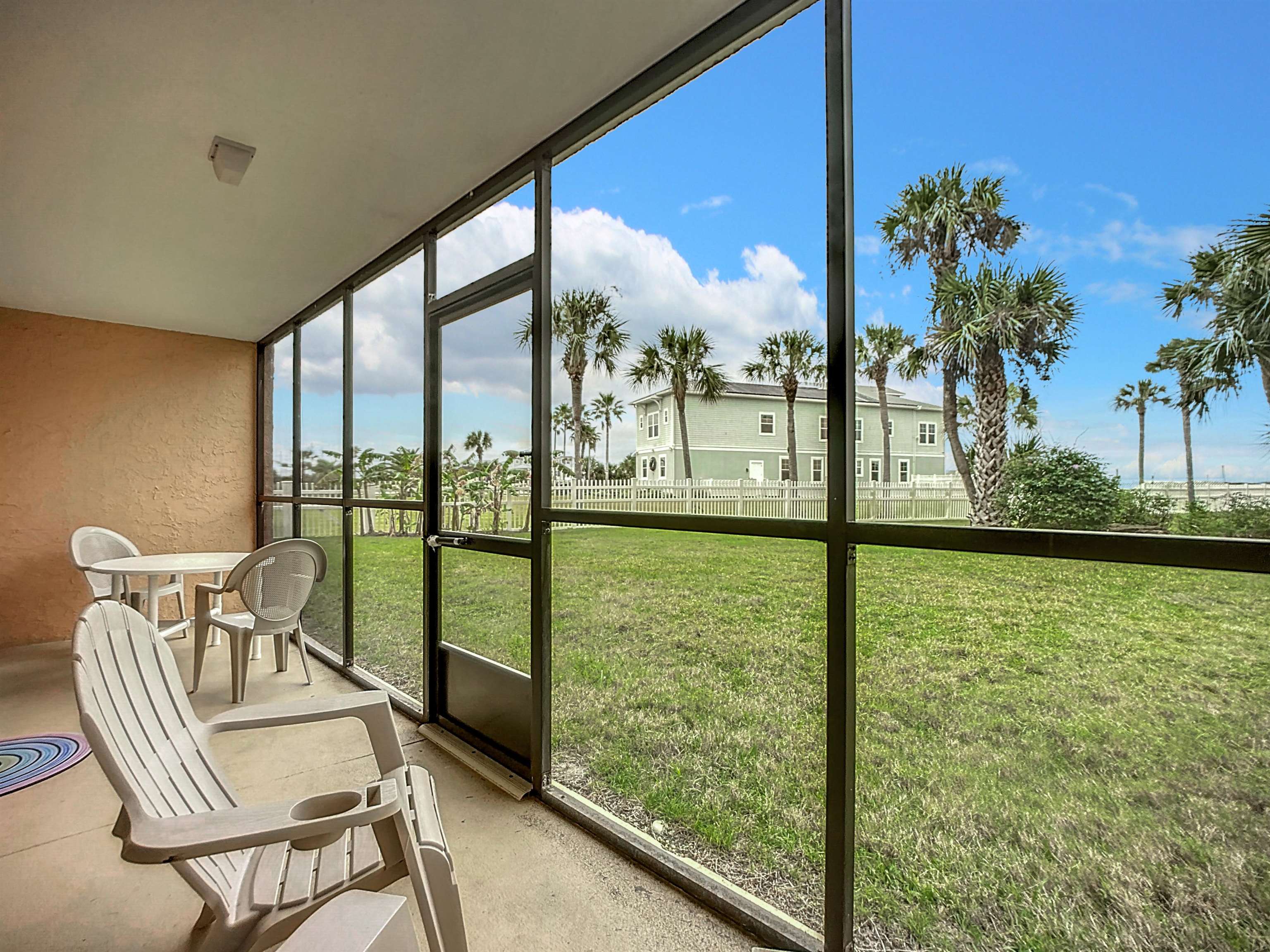 4 Ocean Trace Road, Unit 123 St. Augustine, FL 32080 - Photo 15 of 30 a view of a balcony with chairs and a table