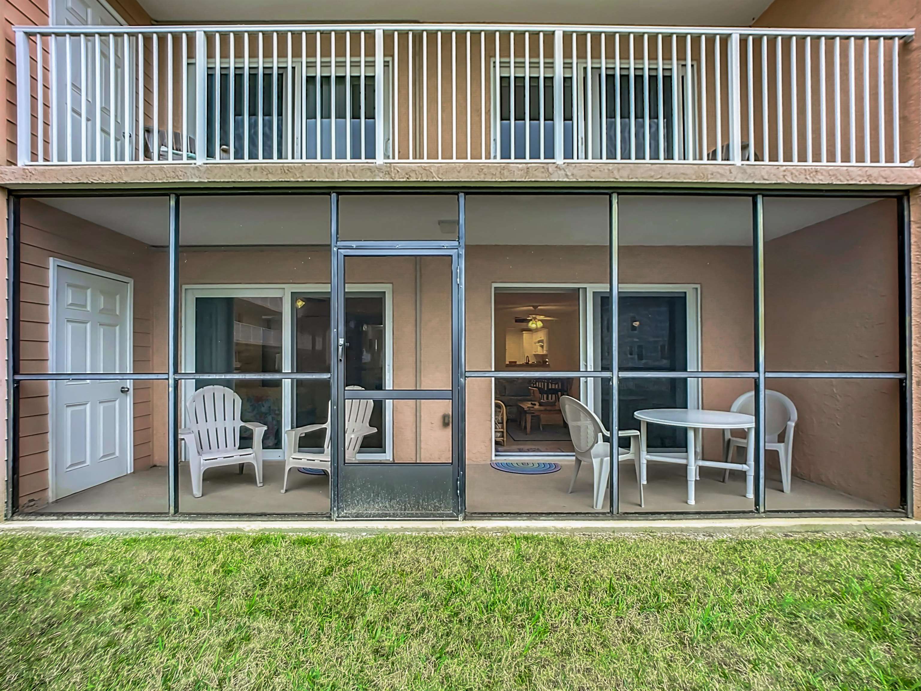 4 Ocean Trace Road, Unit 123 St. Augustine, FL 32080 - Photo 23 of 30 a view of front door of house with outdoor seating and plants
