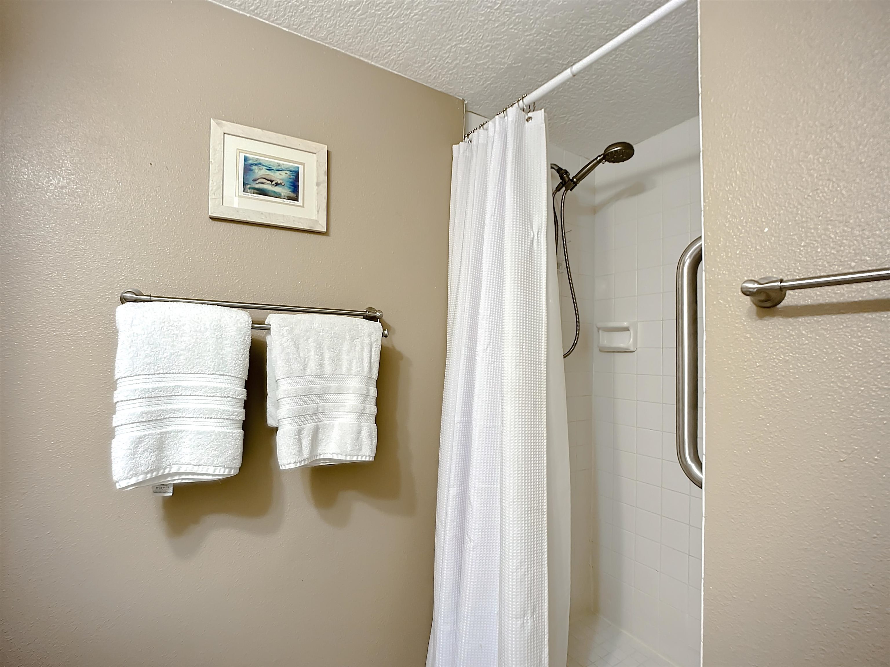 4 Ocean Trace Road, Unit 123 St. Augustine, FL 32080 - Photo 25 of 30 a bathroom with a shower and a tub