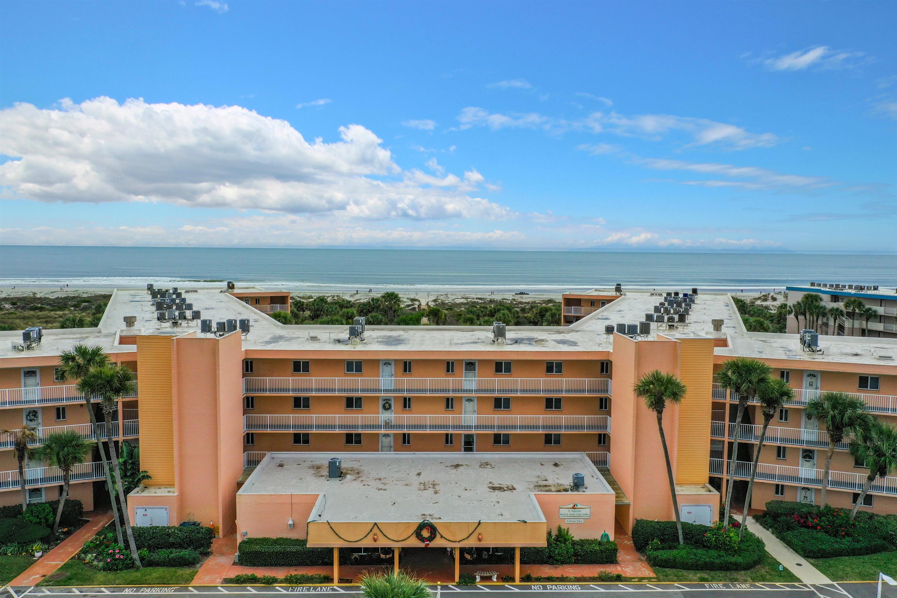 4 Ocean Trace Road, Unit 123 St. Augustine, FL 32080 - Photo 6 of 30 a view of building with yard