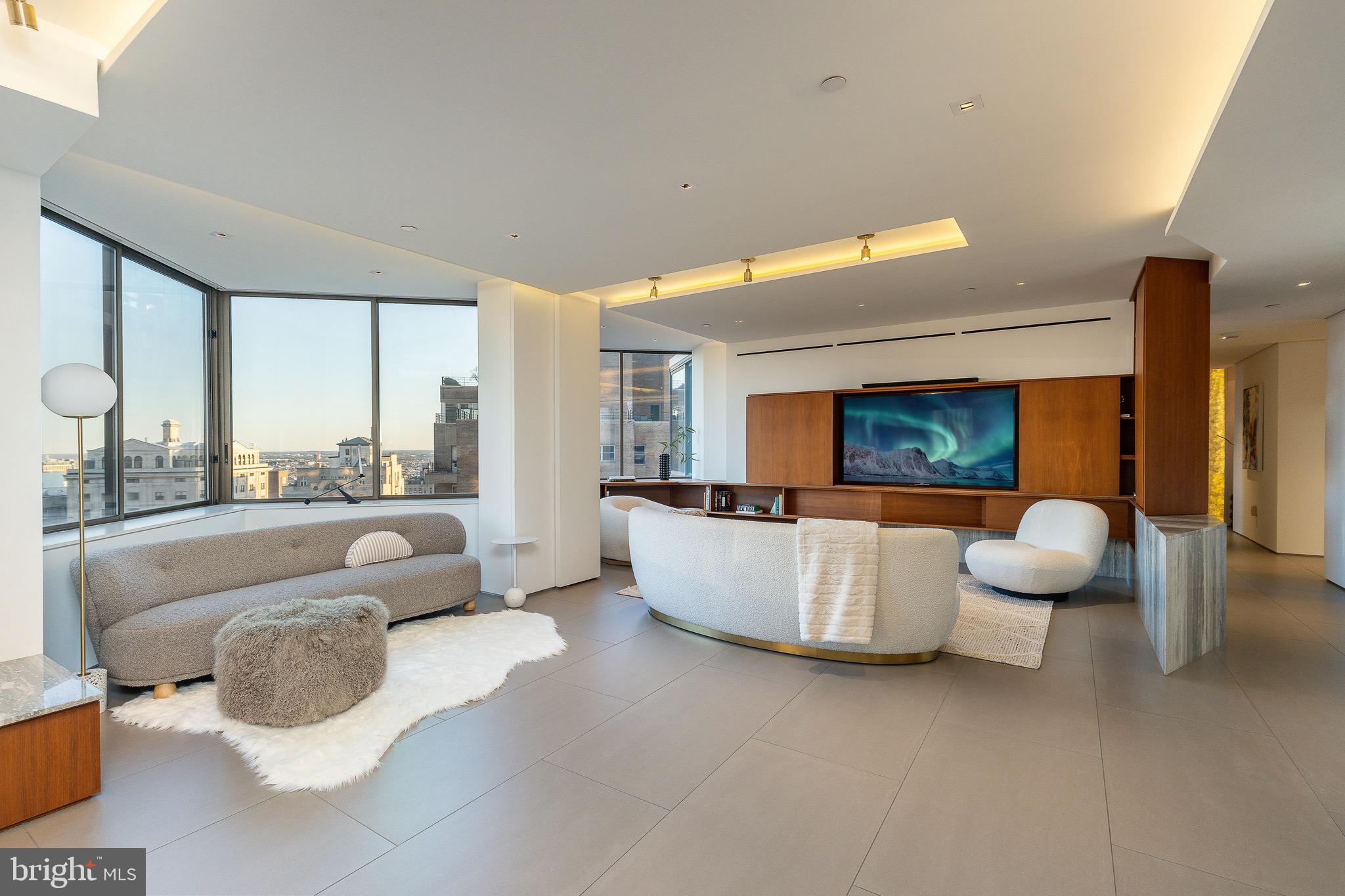 210 West Rittenhouse Square, Unit 21062107 Philadelphia, PA 19103 - Photo 19 of 74 a living room with furniture and a large window
