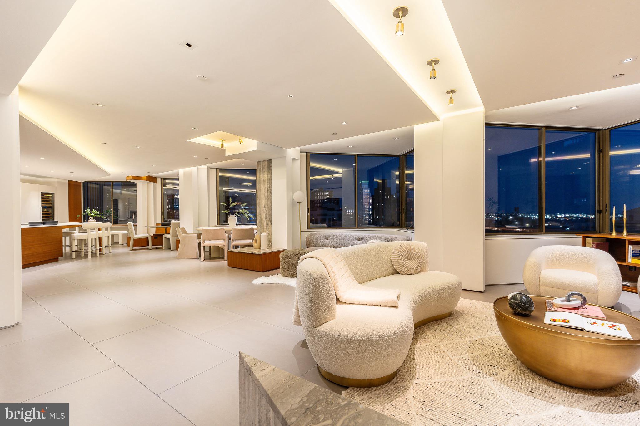 210 West Rittenhouse Square, Unit 21062107 Philadelphia, PA 19103 - Photo 26 of 74 a living room with furniture and a large window