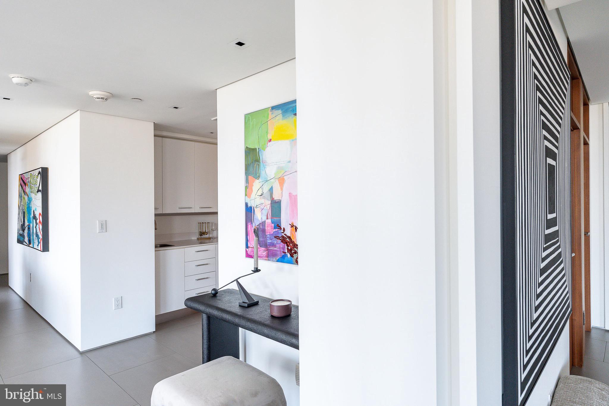 210 West Rittenhouse Square, Unit 21062107 Philadelphia, PA 19103 - Photo 29 of 74 a bathroom with a sink and a mirror