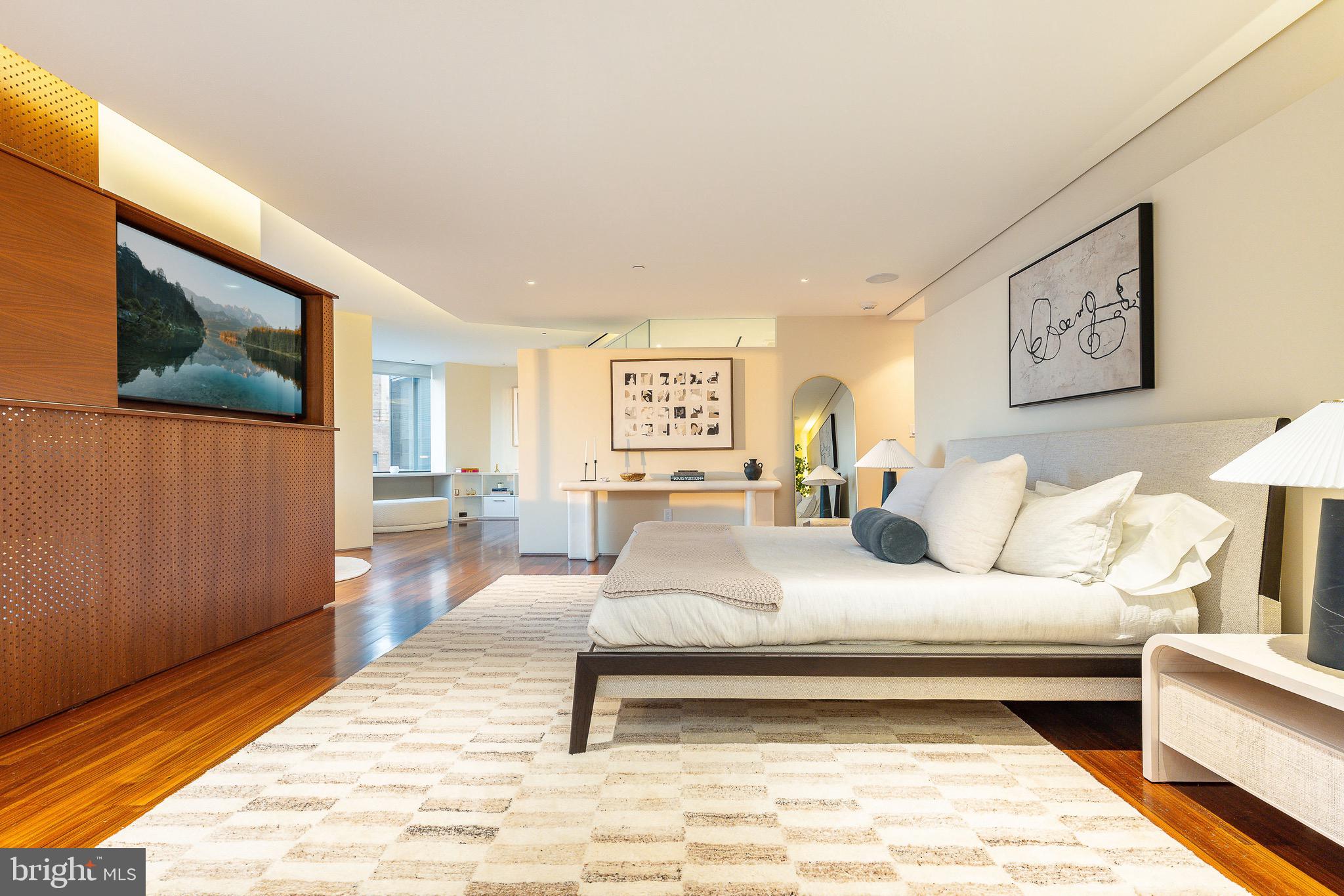 210 West Rittenhouse Square, Unit 21062107 Philadelphia, PA 19103 - Photo 34 of 74 a bedroom with a bed and a night stand
