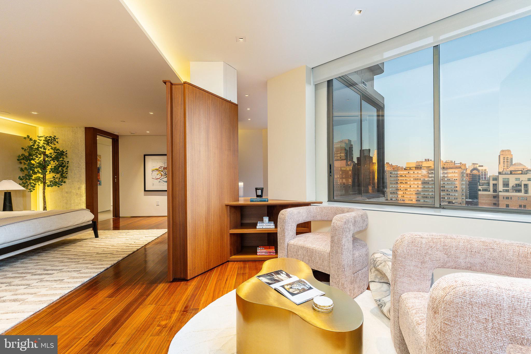 210 West Rittenhouse Square, Unit 21062107 Philadelphia, PA 19103 - Photo 37 of 74 a living room with furniture and a large window