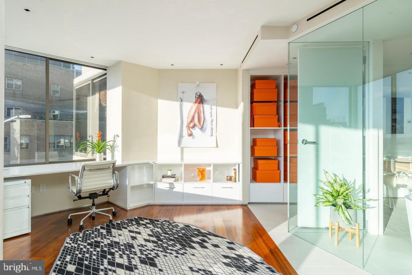 210 West Rittenhouse Square, Unit 21062107 Philadelphia, PA 19103 - Photo 40 of 74 a living room with a couch and a table with wooden floor