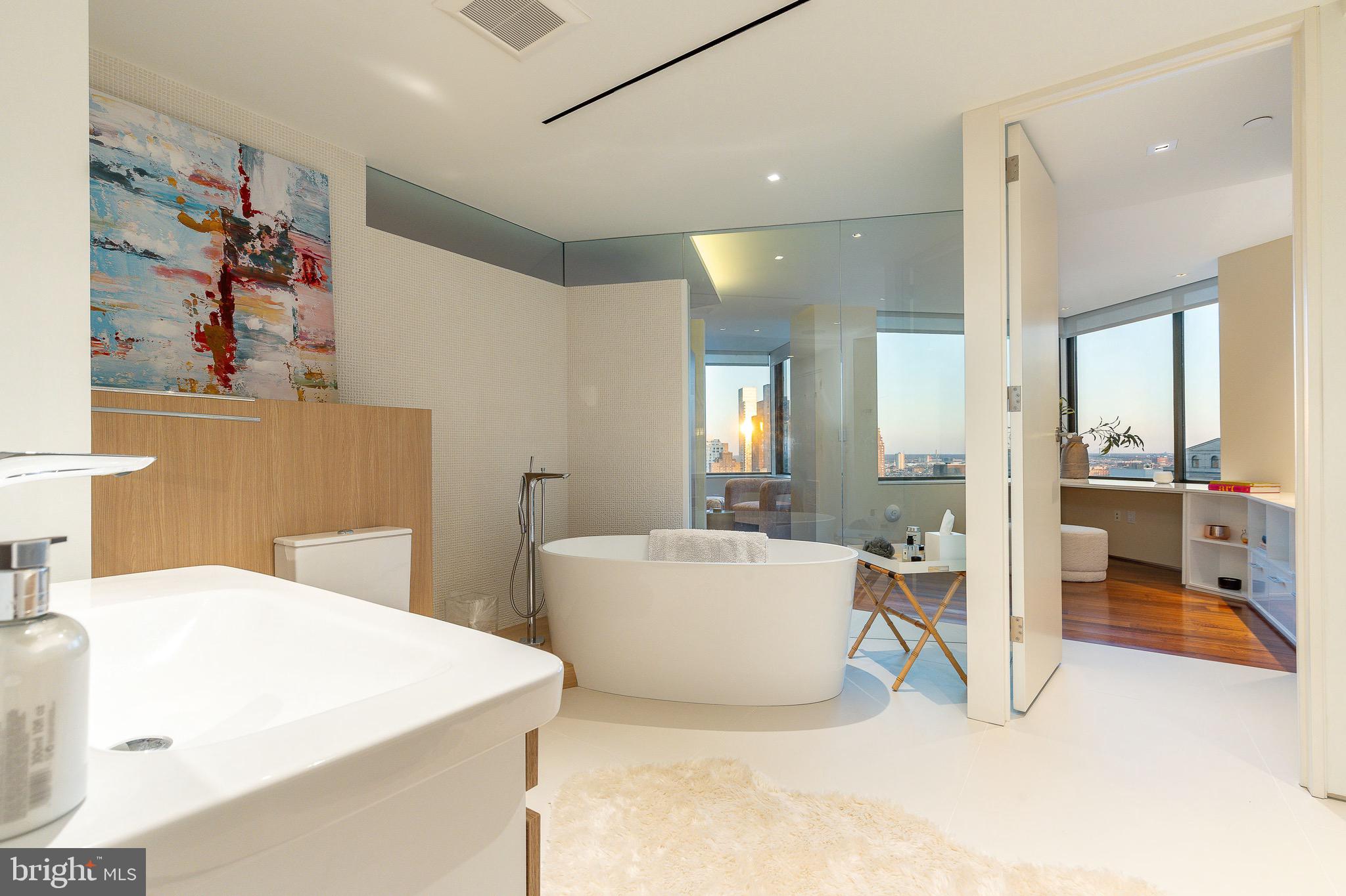 210 West Rittenhouse Square, Unit 21062107 Philadelphia, PA 19103 - Photo 43 of 74 a living room with furniture and a table