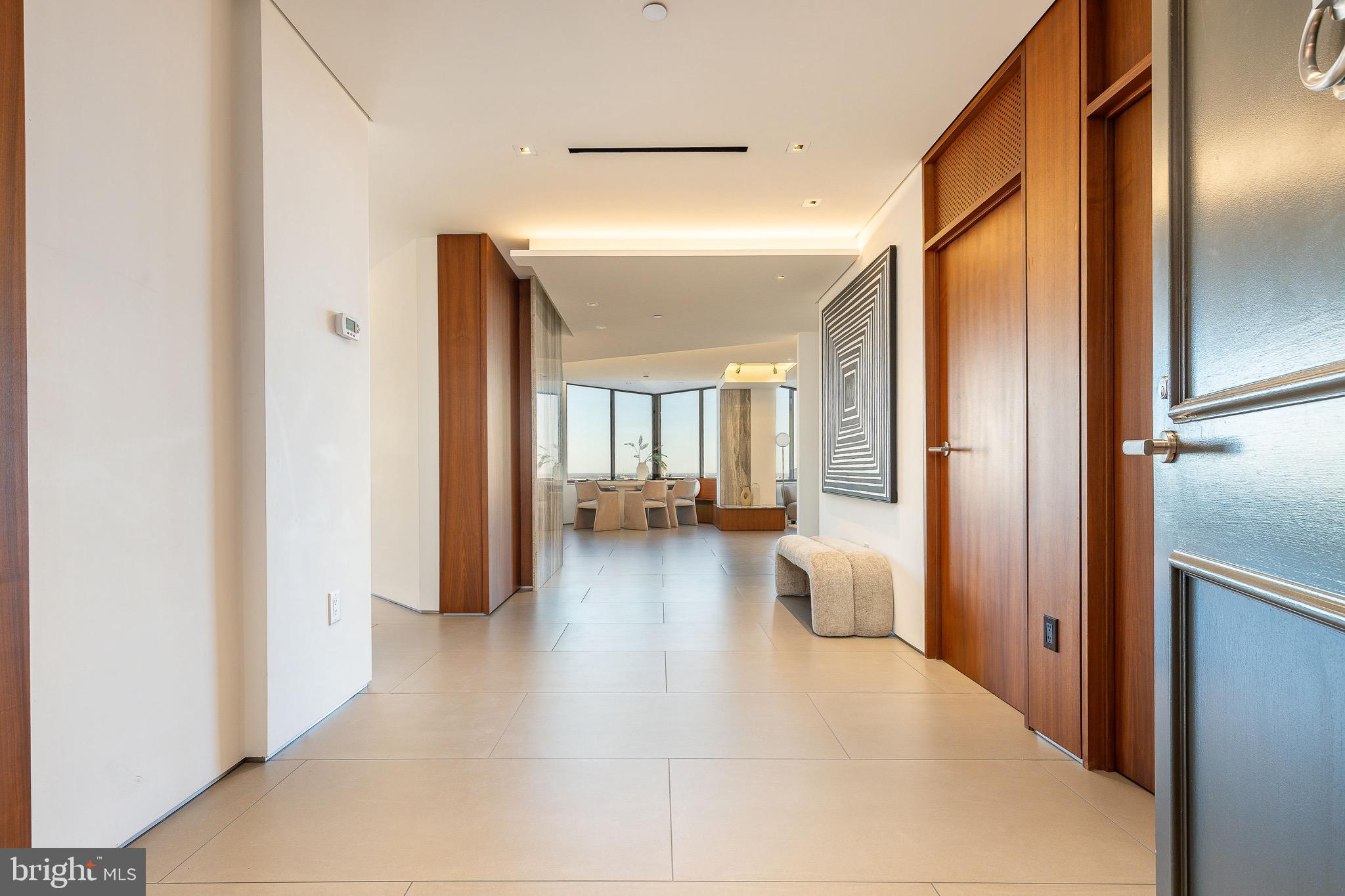 210 West Rittenhouse Square, Unit 21062107 Philadelphia, PA 19103 - Photo 5 of 74 a view of a hallway with couch and chandelier