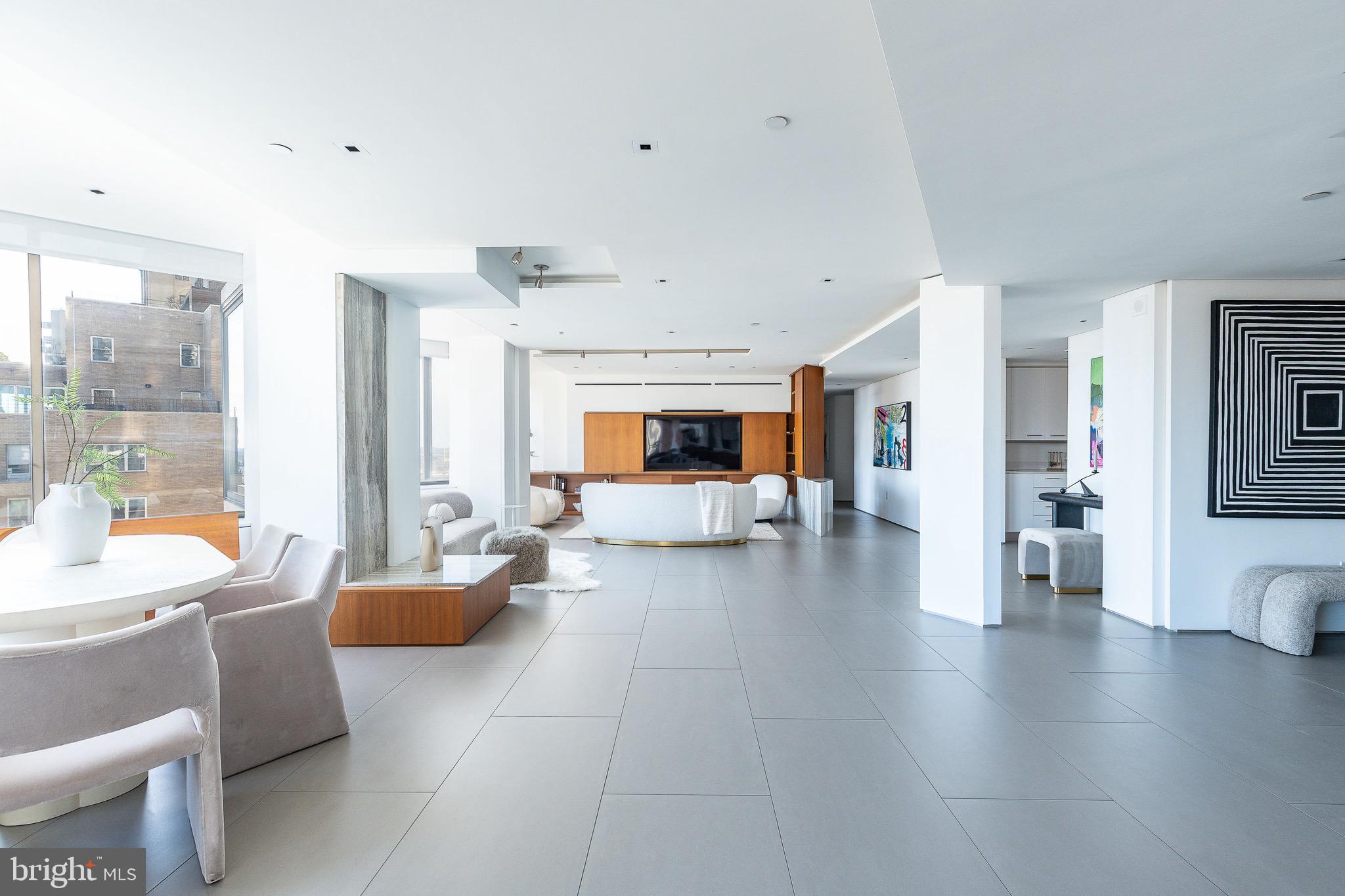 210 West Rittenhouse Square, Unit 21062107 Philadelphia, PA 19103 - Photo 8 of 74 a living room with fireplace furniture and a wooden floor
