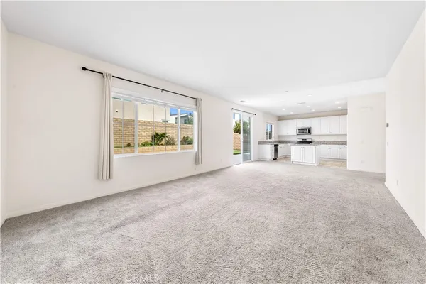 a big room with closet and windows