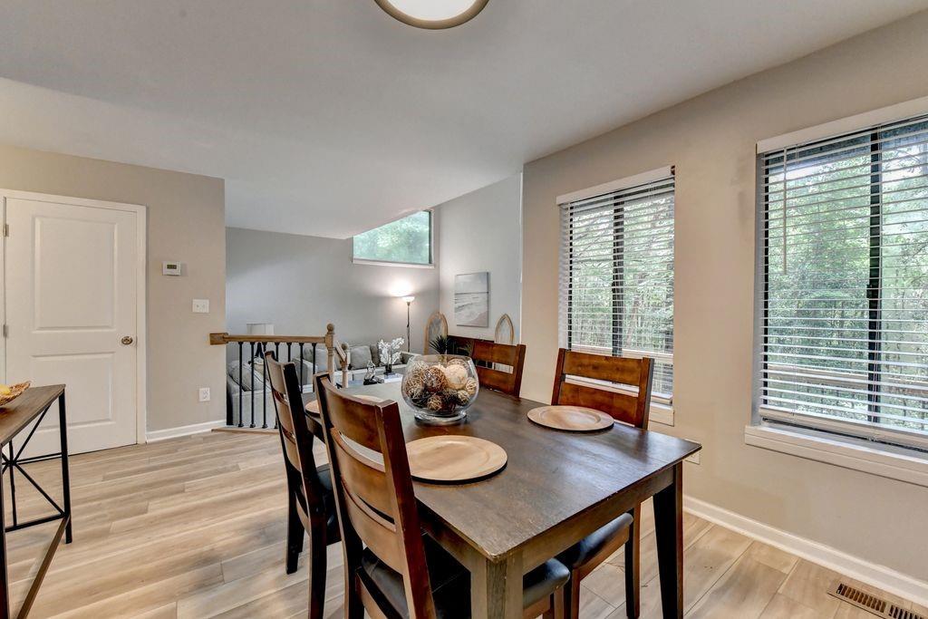2503 Terrace Trail Decatur, GA 30035 - Photo 12 of 45 a view of a dining room with furniture and wooden floor