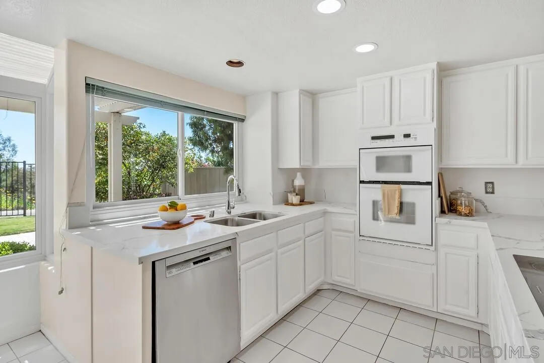 7967 Wing Span Drive San Diego, CA 92119 - Photo 13 of 45 a kitchen that has a sink and cabinets