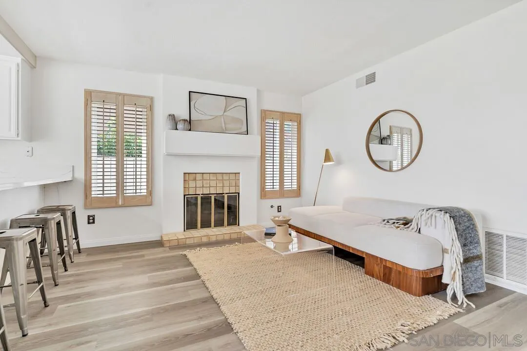 7967 Wing Span Drive San Diego, CA 92119 - Photo 15 of 45 a spacious bedroom with a bed and a large window