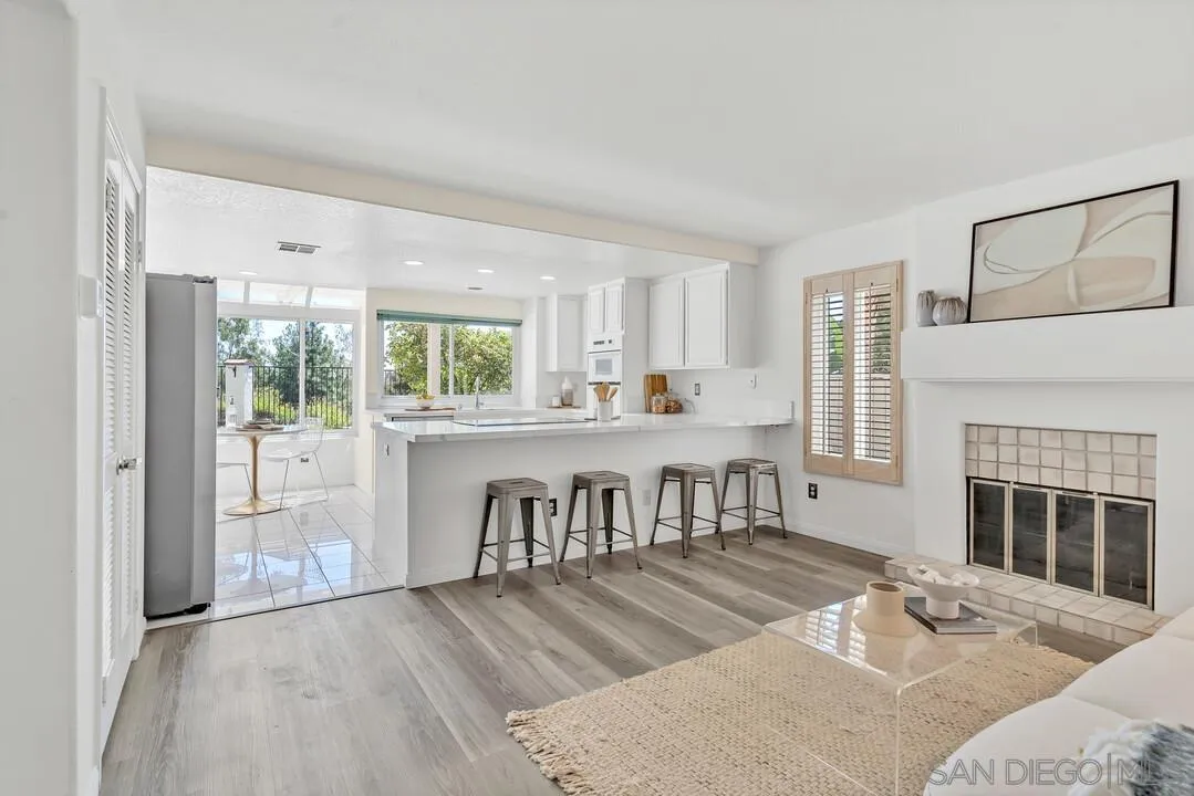 7967 Wing Span Drive San Diego, CA 92119 - Photo 16 of 45 a living room with furniture and a fireplace